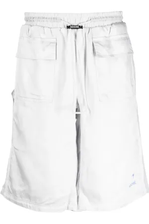 PUMA Shorts deportivos con logo en la hebilla