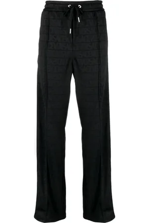 VERSACE Pants con motivo Allover