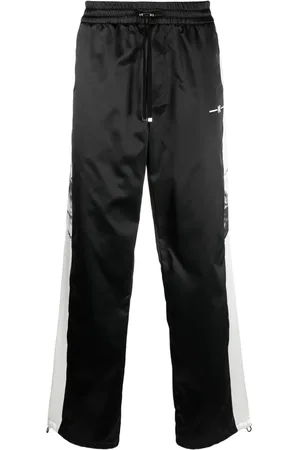AMIRI Pantalones anchos con rayas laterales