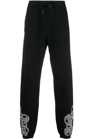 MARCELO BURLON Pants con logo estampado