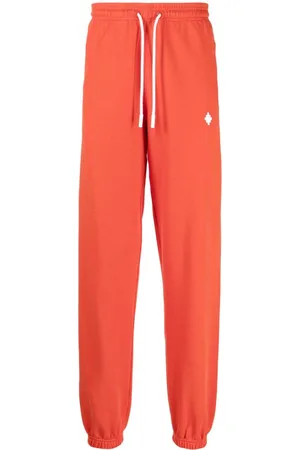 MARCELO BURLON Pants con logo estampado