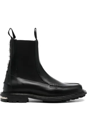 TOGA VIRILIS Botines con detalle de dije