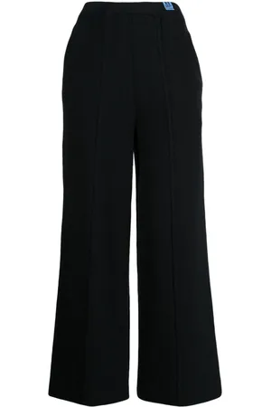 Maison Mihara Yasuhiro Pantalones tejidos con costuras expuestas
