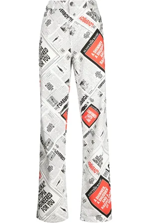Charles Jeffrey Loverboy Jeans anchos con estampado de periódico