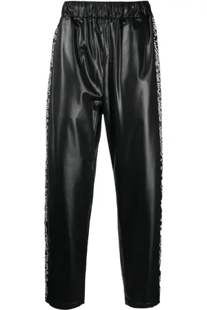 Comme des Garçons Pants con estampado gráfico de x Keith Haring