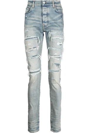 AMIRI Skinny jeans Varsity con detalles rasgados