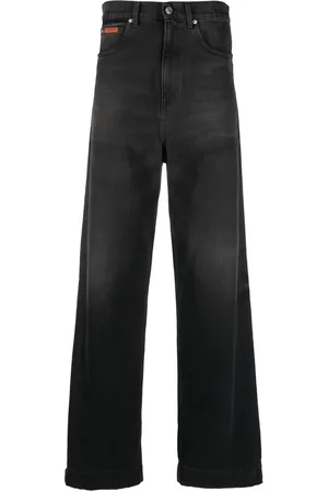 MARTINE ROSE Jeans anchos con parche del logo