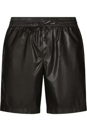 Dolce & Gabbana Shorts de playa con cordones en la pretina y logo estampado