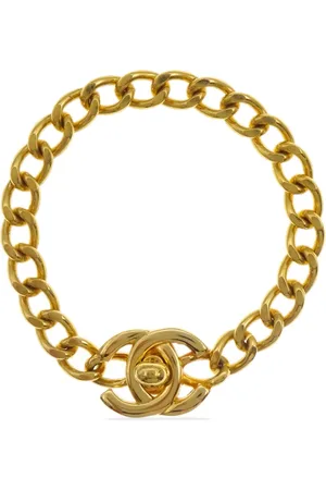 CHANEL Pulsera con cierre giratorio y logo CC 1996