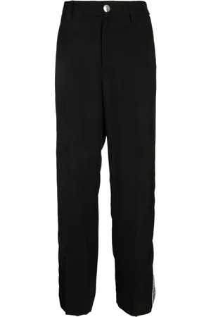 VERSACE Pantalones con franja del logo
