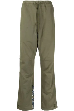 Maharishi Pantalones con dragones estampados