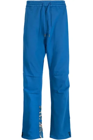 Maharishi Pantalones con dragones estampados