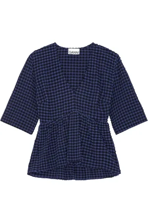 Ganni Blusa con peplum