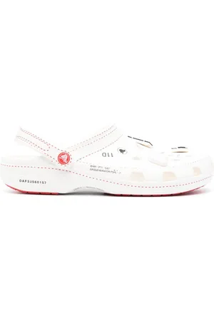 Kanghyuk Flip flops con diseño de perforaciones x