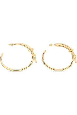 Salvatore Ferragamo Aretes asimétricos en forma de moño