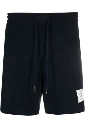 Thom Browne Shorts deportivos con rayas RWB