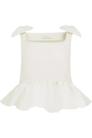Nina Ricci Top con peplum y moño