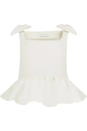 Nina Ricci Top con peplum y moño