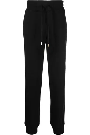 VERSACE Pants con parche del logo