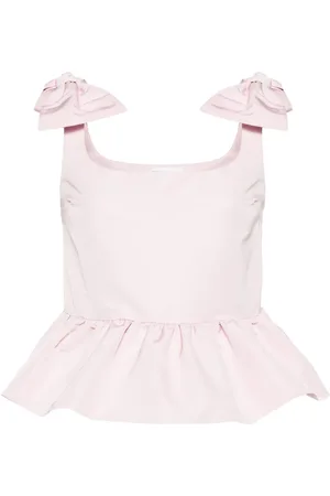 Nina Ricci Top con peplum y moño