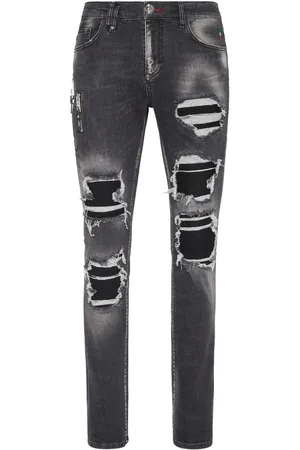Philipp Plein Jeans con tiro medio y detalles rasgados