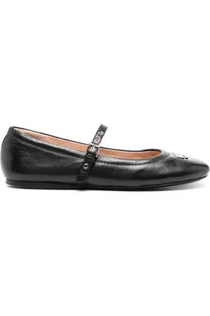 Moschino Flats con placa del logo