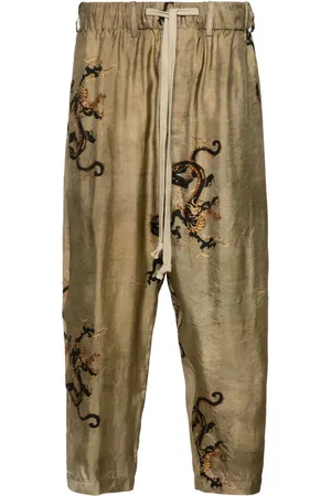 UMA WANG Pantalones tapered con dragones estampados