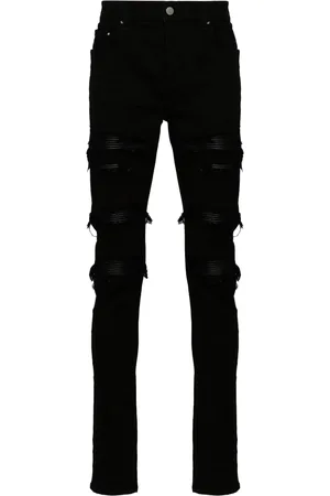 AMIRI Jeans con detalles rasgado
