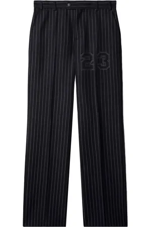 OFF-WHITE Pantalones slim con estampado de número