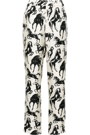 Balmain Pantalones de seda ajustados con caballos estampados