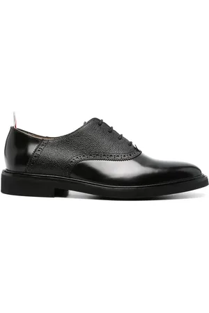 Thom Browne Zapatos casuales con etiqueta del logo