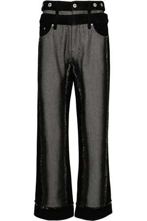 Feng Chen Wang Jeans anchos a capas