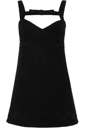 Patou Vestido corto de tweed con moño en el cuello