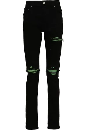 AMIRI Skinny jeans con detalle plisado