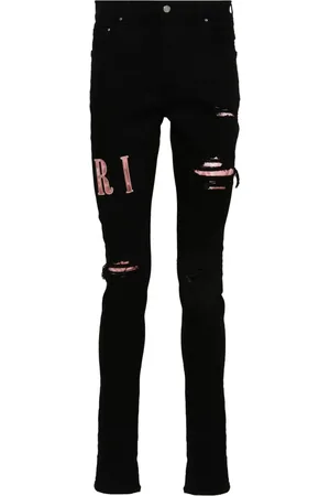 AMIRI Skinny jeans con apliques del logo