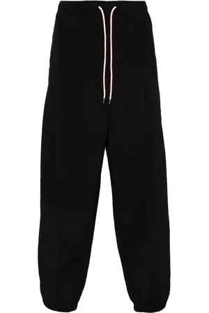 MARCELO BURLON Pants con motivo de cruz
