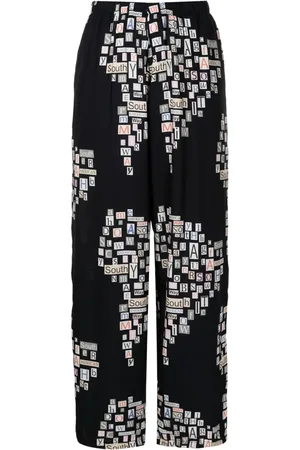 AMIR SLAMA Pantalones rectos con texto estampado