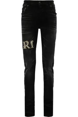 AMIRI Skinny jeans con aplique del logo
