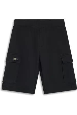 Lacoste Shorts texturizos con cocodrilo bordado