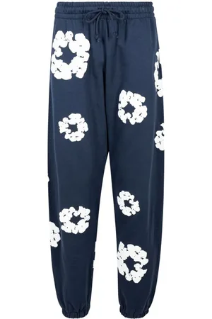 DENIM TEARS Pants con estampado Cotton Wreath