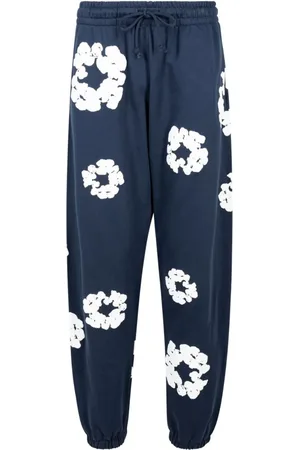 DENIM TEARS Pants con estampado Cotton Wreath