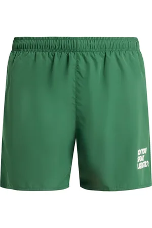 Lacoste Shorts de playa con eslogan estampado
