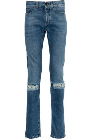 Saint Laurent Jeans slim con detalles rasgados