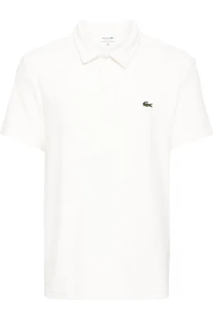 Lacoste Playera tipo polo de terciopelo con aplique del logo