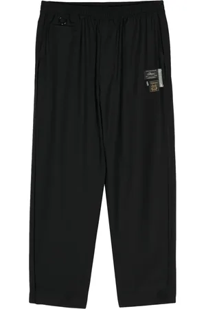 UNDERCOVER Pantalones rectos con aplique del logo