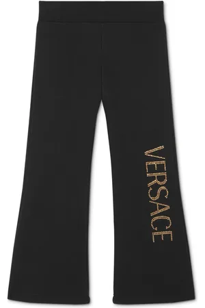 VERSACE Pantalones acampanados con logo y aplique
