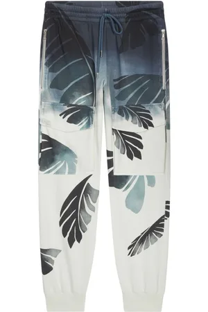 DRIES VAN NOTEN Pantalones con palmeras estampadas