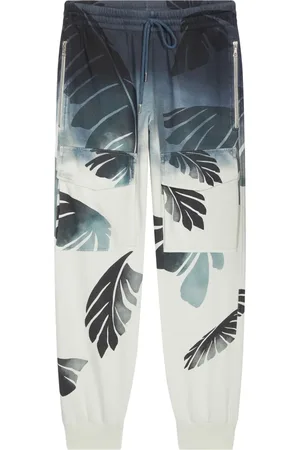 DRIES VAN NOTEN Pantalones con palmeras estampadas