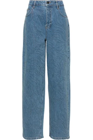 ROTATE Jeans anchos con detalles de strass