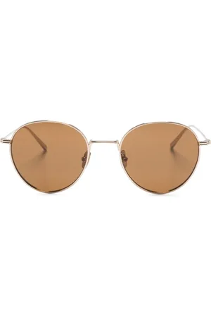 Totême Lentes de sol con armazón redonda y logo grabado